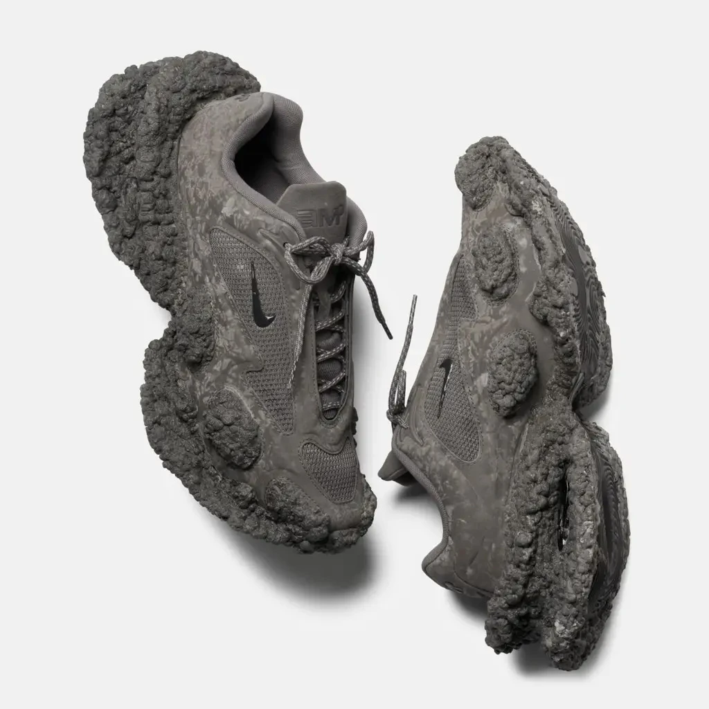 Sneakers with oversized soles modeled on the surface of natural rock.